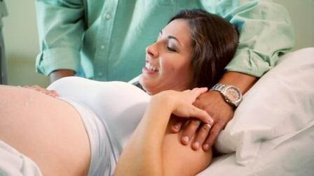 A woman receives an ultrasound and love from her husband.