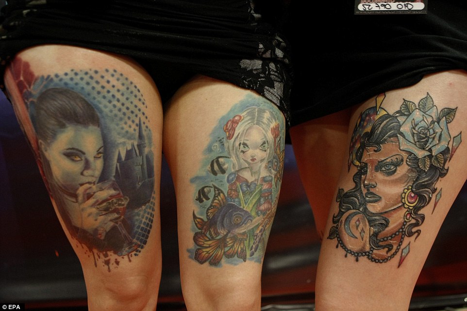 29D2B80100000578-3133591-All_in_a_line_Two_women_show_off_their_tattoos_one_of_which_feat-a-5_1434918853038