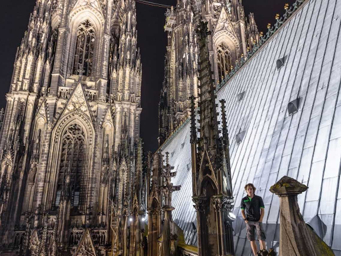 escaping-the-crowds-and-arriving-in-the-evening-the-two-snuck-to-the-cathedrals-scaffolding-and-climbed-to-the-top-with-nothing-but-steel-poles-to-support-their-ascent