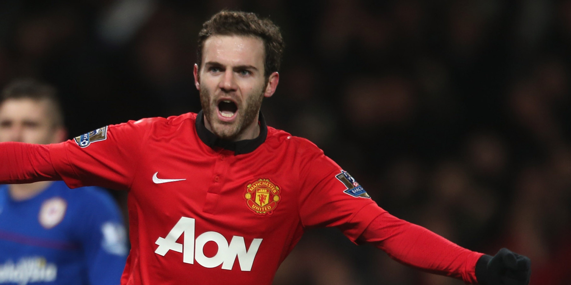 MANCHESTER, ENGLAND - JANUARY 28:  Juan Mata of Manchester United celebrates Robin van Persie scoring their first goal during the Barclays Premier League match between Manchester United and Cardiff City at Old Trafford on January 28, 2014 in Manchester, England.  (Photo by John Peters/Man Utd via Getty Images)