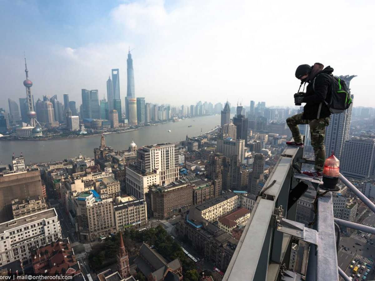 they-even-climbed-billboards-to-get-overarching-shots-of-shanghais-seaport-and-its-array-of-skyscrapers