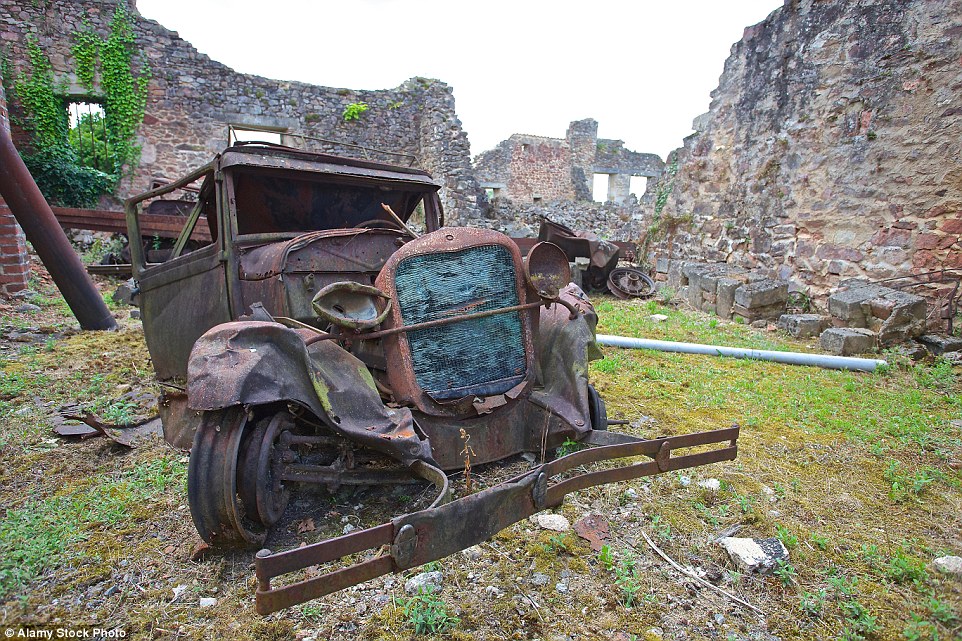 2CB84A7E00000578-3247748-The_village_has_been_left_untouched_since_the_massacre_and_a_new-a-5_1443510847442