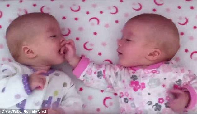 2DA5C73400000578-3283906-This_heartwarming_video_shows_the_identical_twin_sisters_happily-a-21_1445478112451