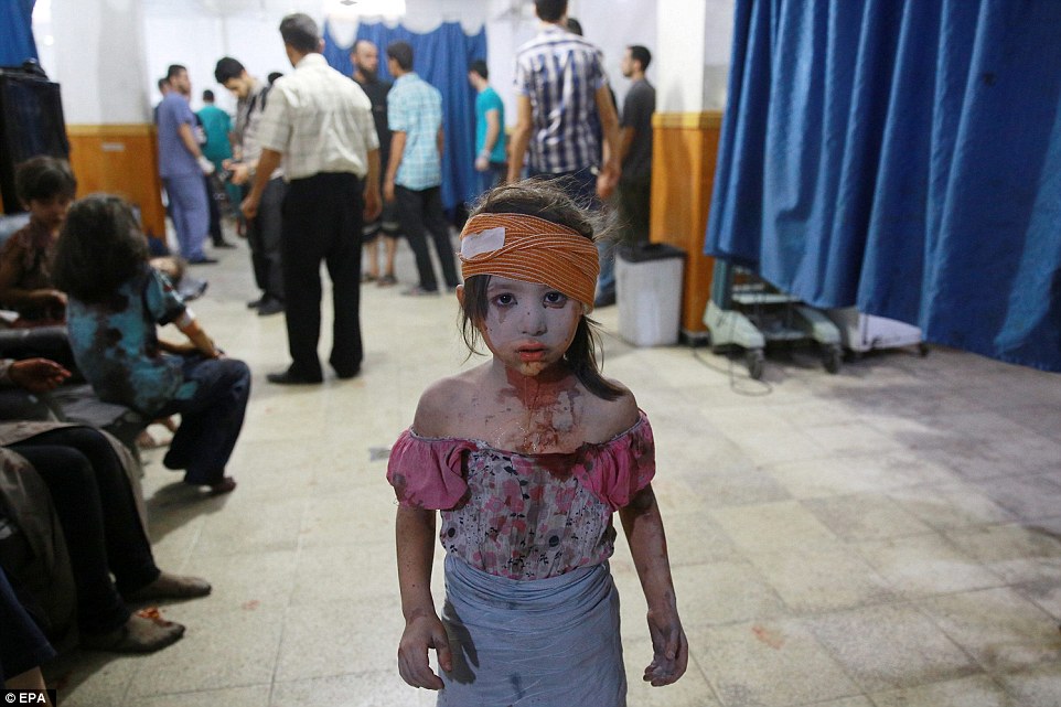 31571EC600000578-3452659-The_picture_shows_a_wounded_Syrian_girl_looking_on_at_a_make_shi-a-15_1455813038679