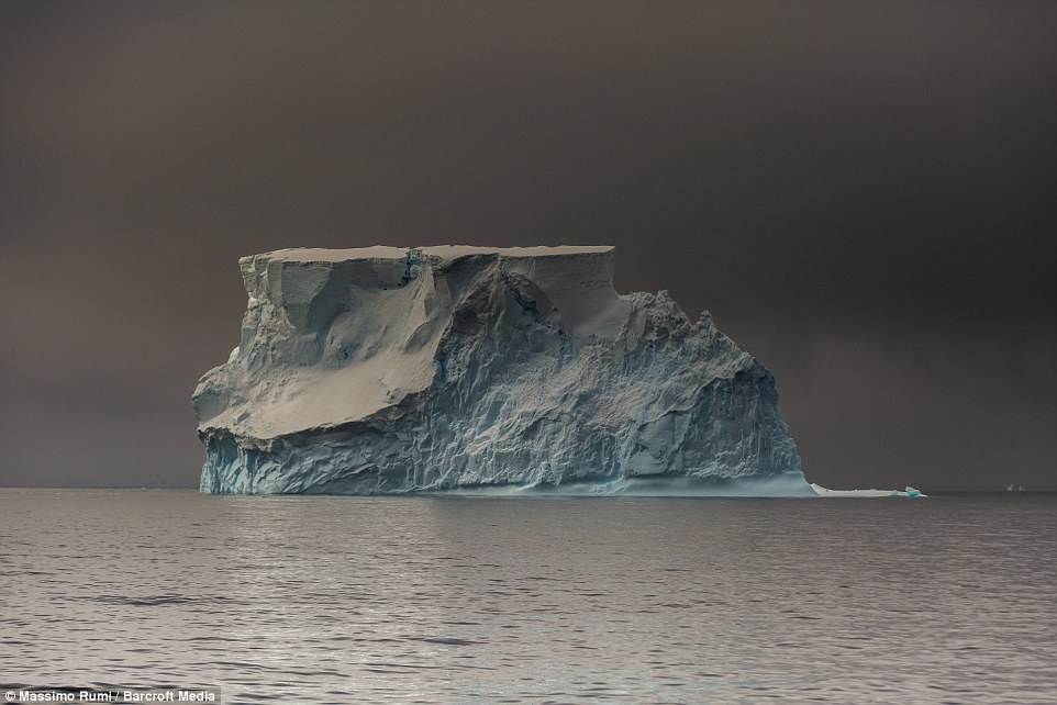 318AD47000000578-3463605-A_giant_lone_iceberg_floating_in_the_Antarctic_ocean_with_electr-a-4_1456408286297